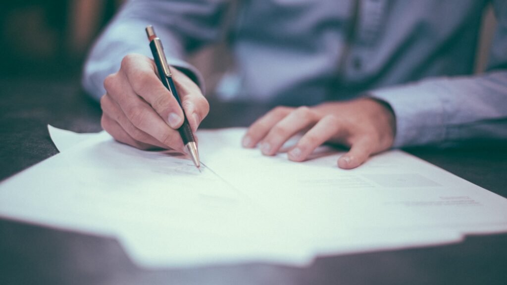 Loan approval paperwork being signed